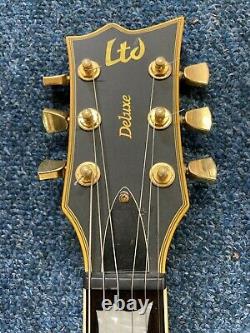 ESP LTD EC-1000 W11080348 Deluxe electric guitar Black & Gold condition report