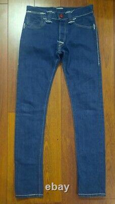 Collection rare de jeans Levi's Red Limited Edition bleu, taille W30 L34, en parfait état.